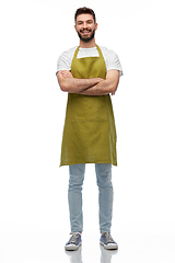 Image showing happy barman or waiter in apron with crossed arms