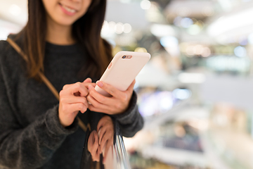 Image showing Woman using smart phone for online