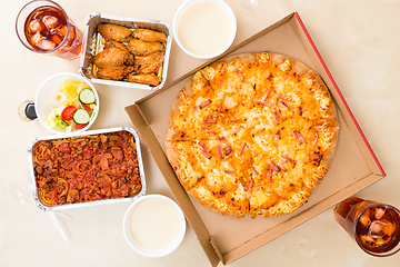 Image showing Top view of eating pizza take away