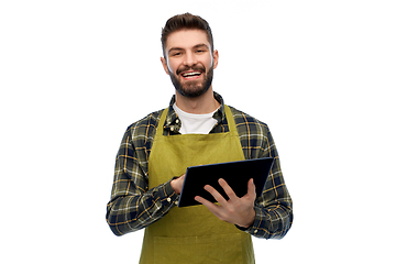 Image showing happy male gardener or farmer with tablet pc