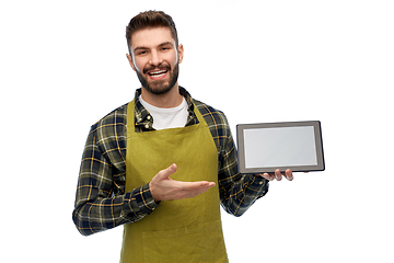 Image showing happy male gardener or farmer with tablet pc