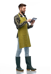 Image showing happy male gardener or farmer with tablet pc