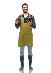 Image showing happy male gardener or farmer with tablet pc