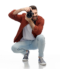 Image showing smiling man or photographer with digital camera