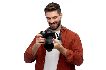 Image showing smiling man or photographer with digital camera