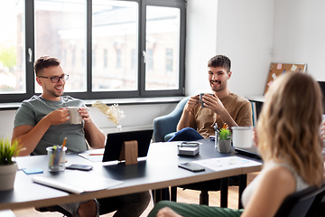 Image showing team of startuppers drinking coffee at office