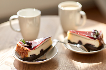 Image showing piece of chocolate cake on wooden table