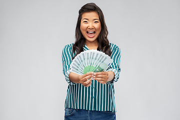 Image showing asian woman with hundred euro money banknotes