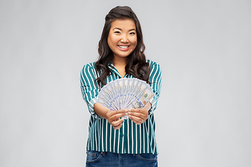 Image showing asian woman with hundred dollar money banknotes