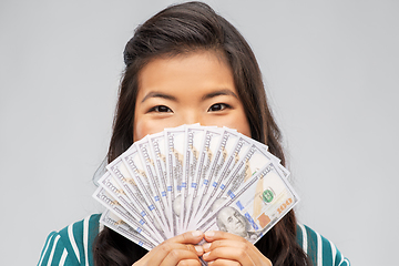 Image showing asian woman with hundred dollar money banknotes