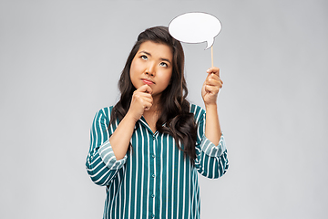 Image showing thinking asian woman holding speech bubble