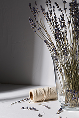 Image showing dried lavender flowers in vase and craft rope