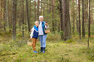 Image showing grandmother and grandson with baskets take selfie