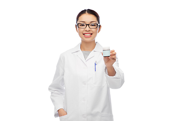 Image showing smiling asian female doctor or nurse with medicine