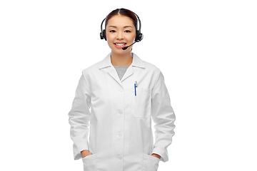 Image showing smiling asian female doctor or nurse in headset