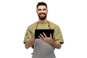 Image showing smiling waiter in apron with tablet pc computer