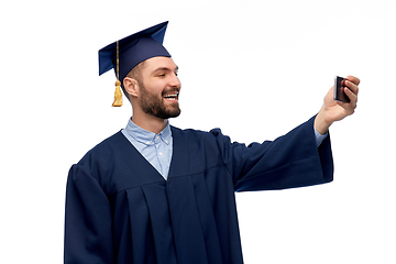 Image showing male graduate student with smartphone takes selfie