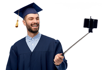 Image showing male graduate student with smartphone takes selfie