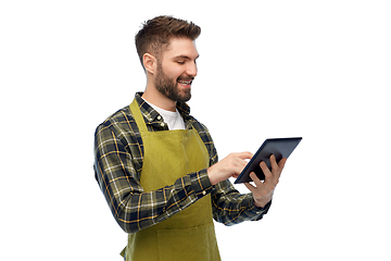 Image showing happy male gardener or farmer with tablet pc