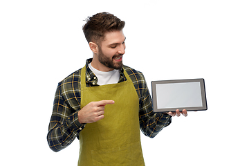 Image showing happy male gardener or farmer with tablet pc