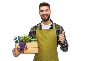 Image showing happy gardener or farmer with box of garden tools