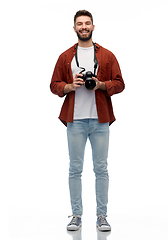 Image showing smiling man or photographer with digital camera