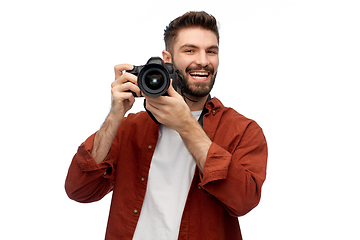 Image showing smiling man or photographer with digital camera