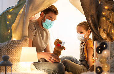 Image showing happy family playing with toy in kids tent at home