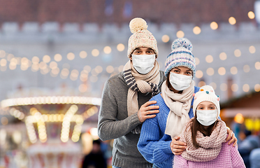 Image showing family in medical masks at christmas market
