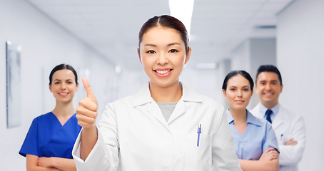 Image showing asian female doctor showing thumbs up at hospital