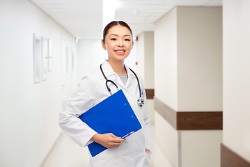 Image showing asian female doctor with clipboard at hospital