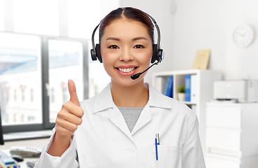 Image showing smiling asian female doctor in headset at hospital