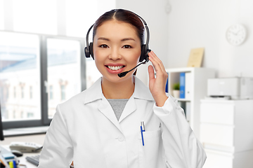 Image showing smiling asian female doctor in headset at hospital