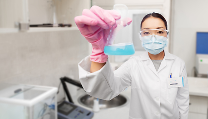 Image showing asian doctor or scientist in mask with flask