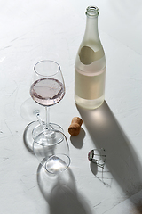 Image showing wine glasses and champagne bottle dropping shadows