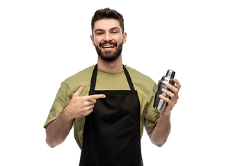 Image showing happy barman with shaker preparing