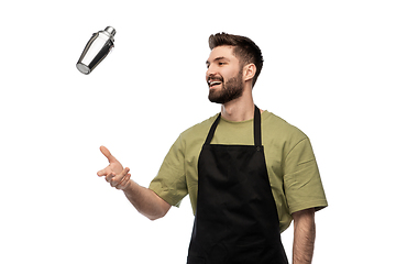 Image showing happy barman with shaker preparing