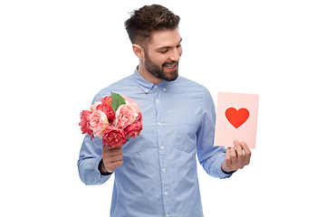 Image showing happy man with flowers and valentine's day card