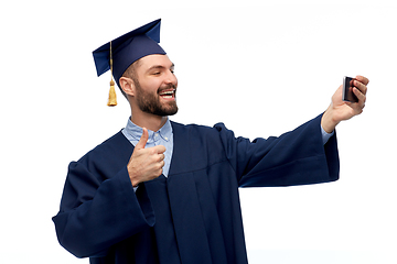 Image showing male graduate student with smartphone takes selfie