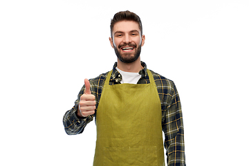 Image showing happy male gardener or farmer showing thumbs up