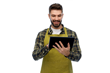 Image showing happy male gardener or farmer with tablet pc