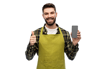 Image showing happy male farmer with smartphone shows thumbs up