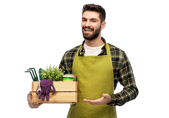 Image showing happy gardener or farmer with box of garden tools