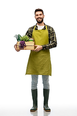 Image showing happy gardener or farmer with box of garden tools