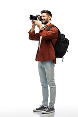 Image showing happy man or photographer with camera and backpack