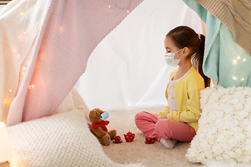 Image showing little girl playing tea party in kids tent at home