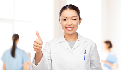 Image showing asian female doctor showing thumbs up at hospital