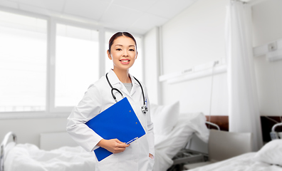 Image showing asian female doctor with clipboard at hospital