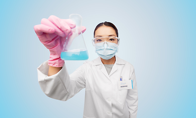 Image showing asian doctor or scientist in mask with flask