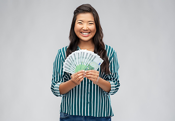 Image showing asian woman with hundred euro money banknotes